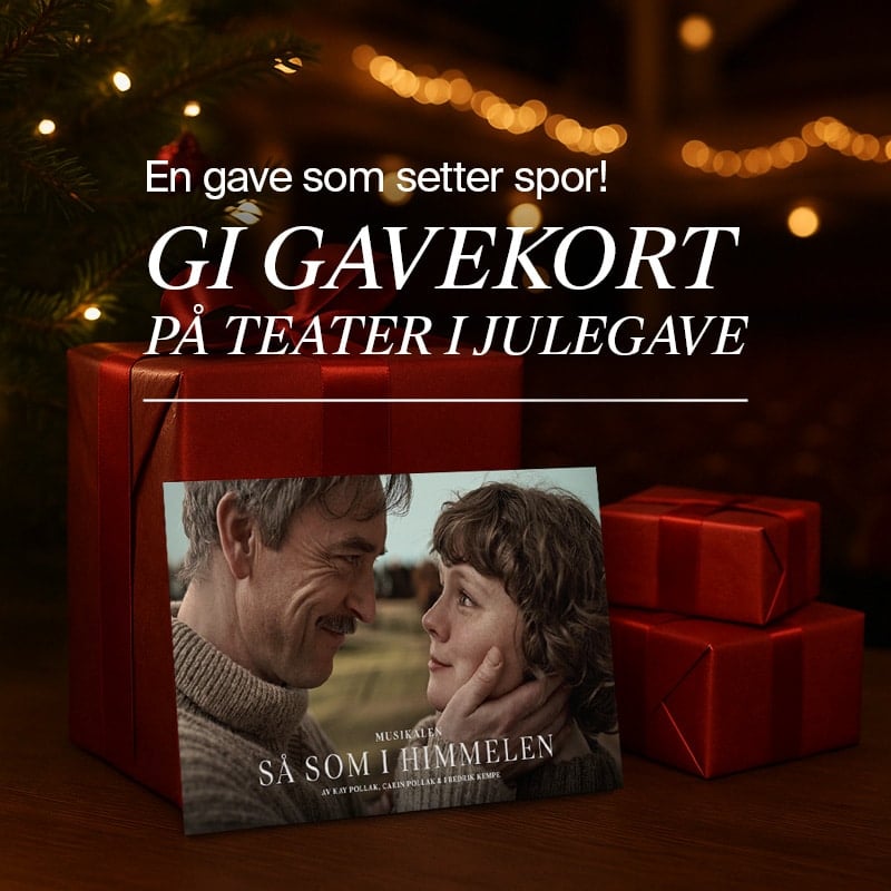Et teatergavekort vises foran innpakkede gaver og et juletre, med et nærbilde av to mennesker som smiler til hverandre.